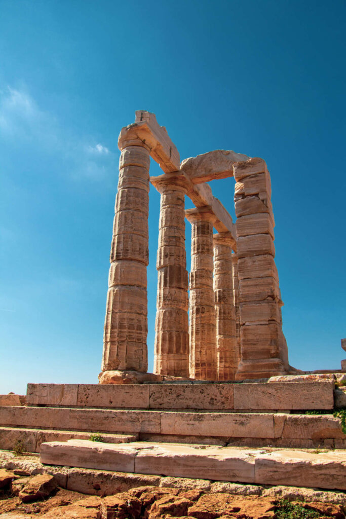 The ancient marble columns of the Temple of Poseidon at Cape Sounion under a clear blue sky, a recommended final stop on a Greece itinerary 10 days in 2026.