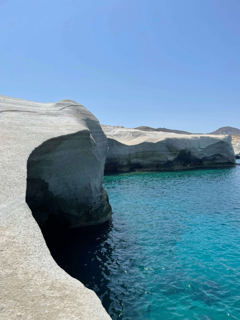 The striking white volcanic rock landscape of Sarakiniko Beach in Milos, a premier destination among the best Greek islands for couples in 2026.