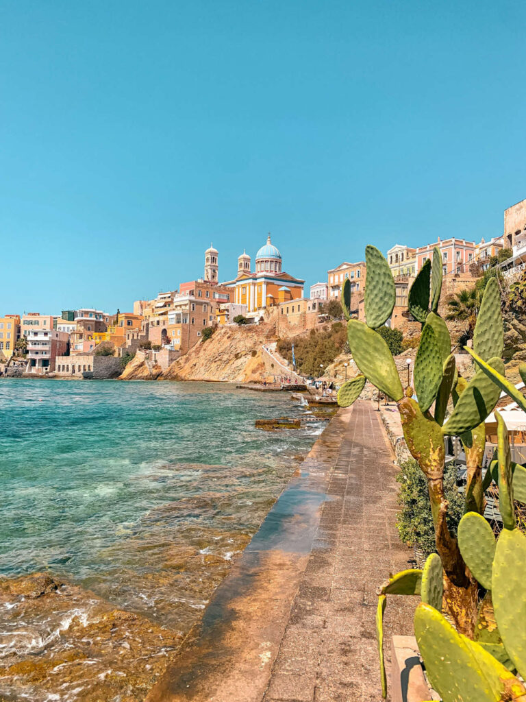 Stunning pastel neoclassical mansions rising above the harbor of Ermoupoli in Syros, a top destination among the best Greek islands for couples in 2026 seeking culture.