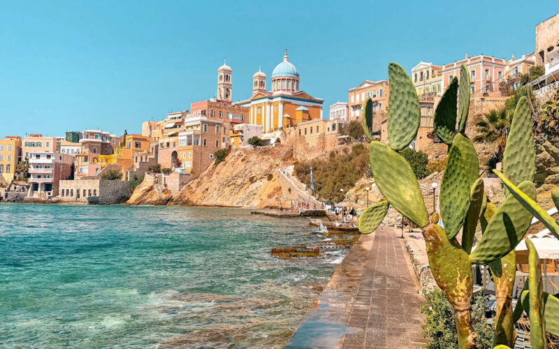 Stunning pastel neoclassical mansions rising above the harbor of Ermoupoli in Syros, a top destination among the best Greek islands for couples in 2026 seeking culture.